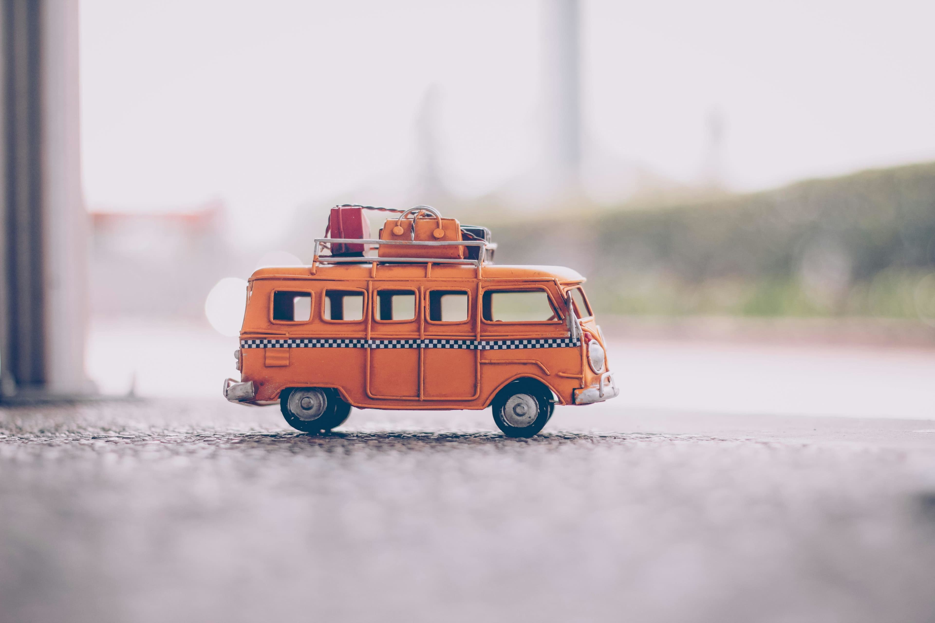 little orange van with suitcases